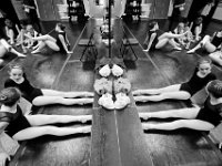 Ballet D class students are reflected in the mirror as they work on stretching and warming up their feet before pointe class begins at the New Bedford Ballet studio on Purchast Street in the north end of New Bedford.   [ PETER PEREIRA/THE STANDARD-TIMES/SCMG ]